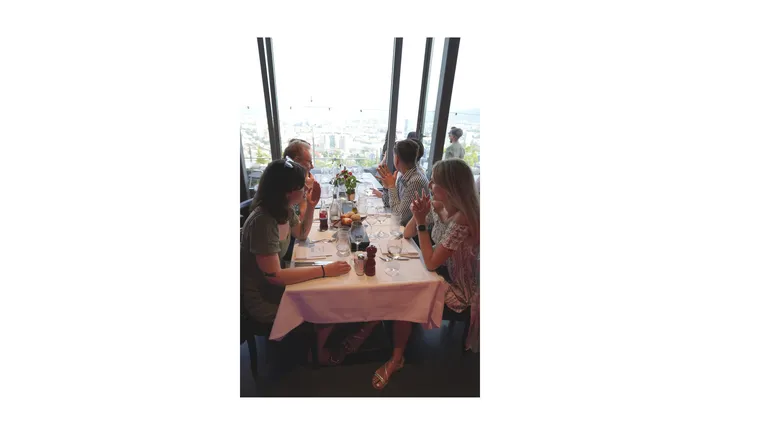 Freelancers enjoying a meal at Bosshard & Partner's 2024 summer event at Restaurant Waid.