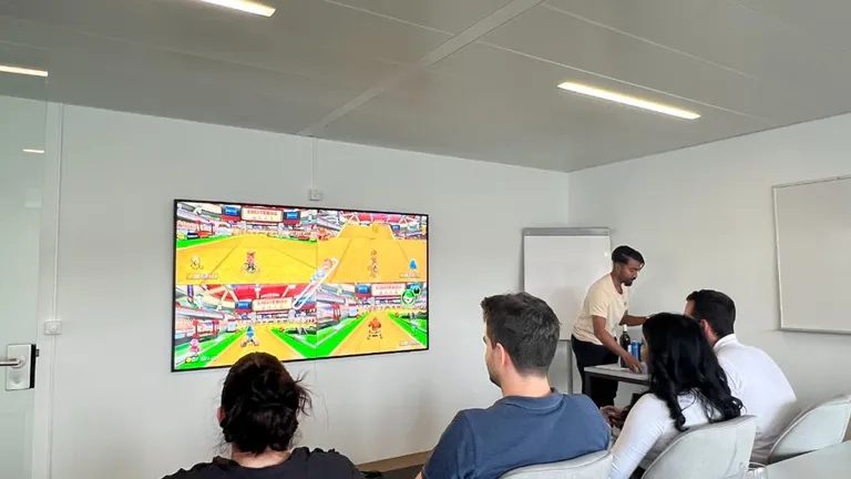 Bosshard & Partner employees play Mario Kart.